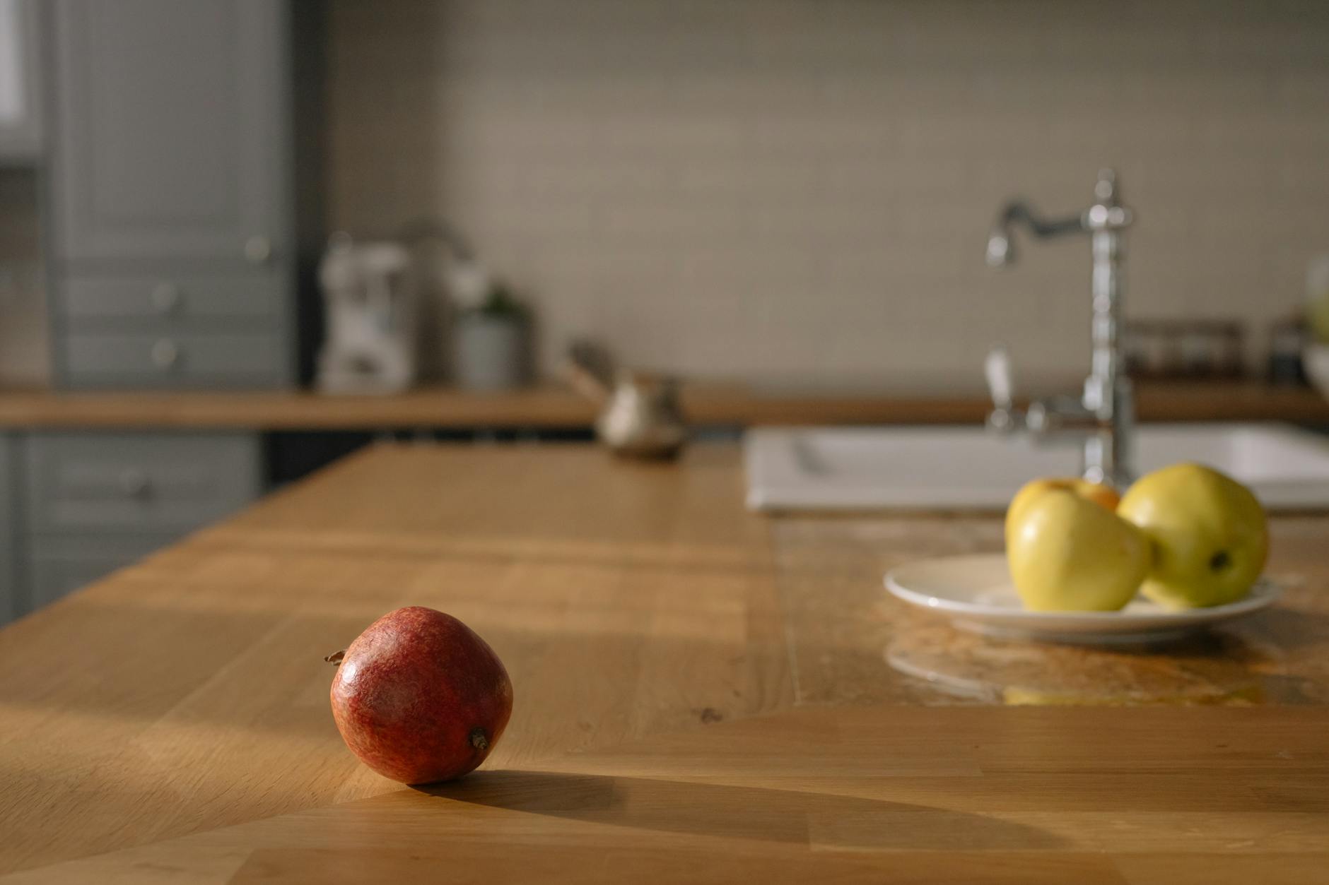 a variety of colorful fruits and vegetables on a kitchen table