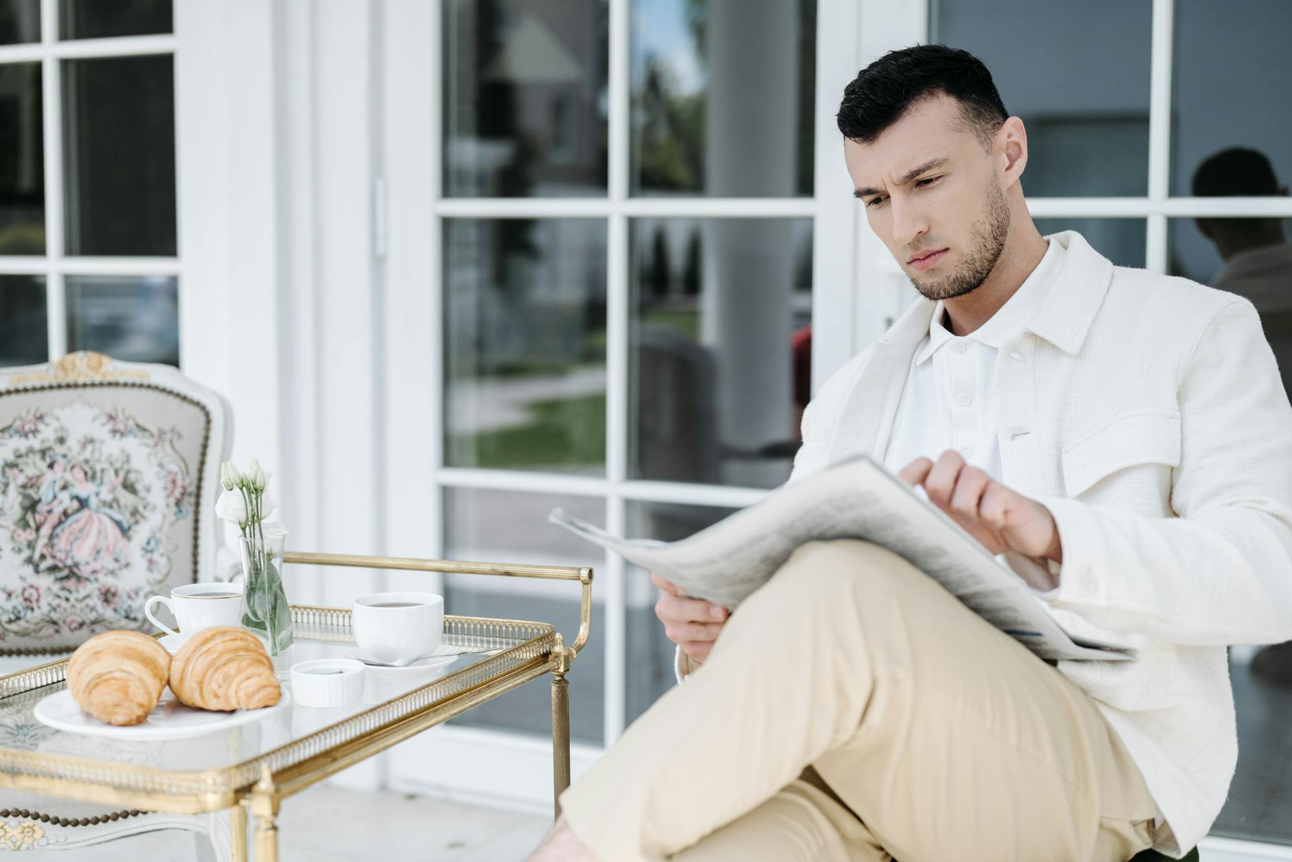 person enjoying breakfast outdoors in a sunny garden