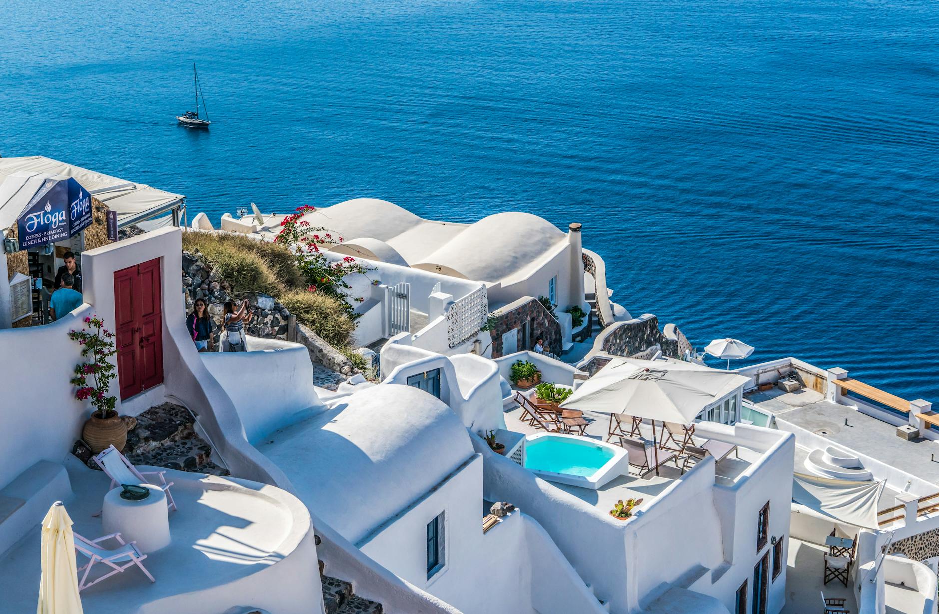 Aerial view of Santorini, Greece with white buildings and blue sea