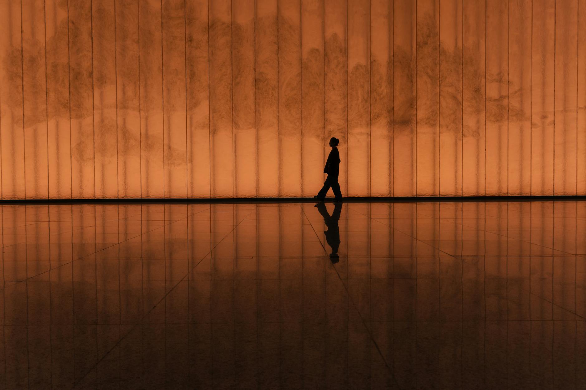 A peaceful evening setting with a person reflecting