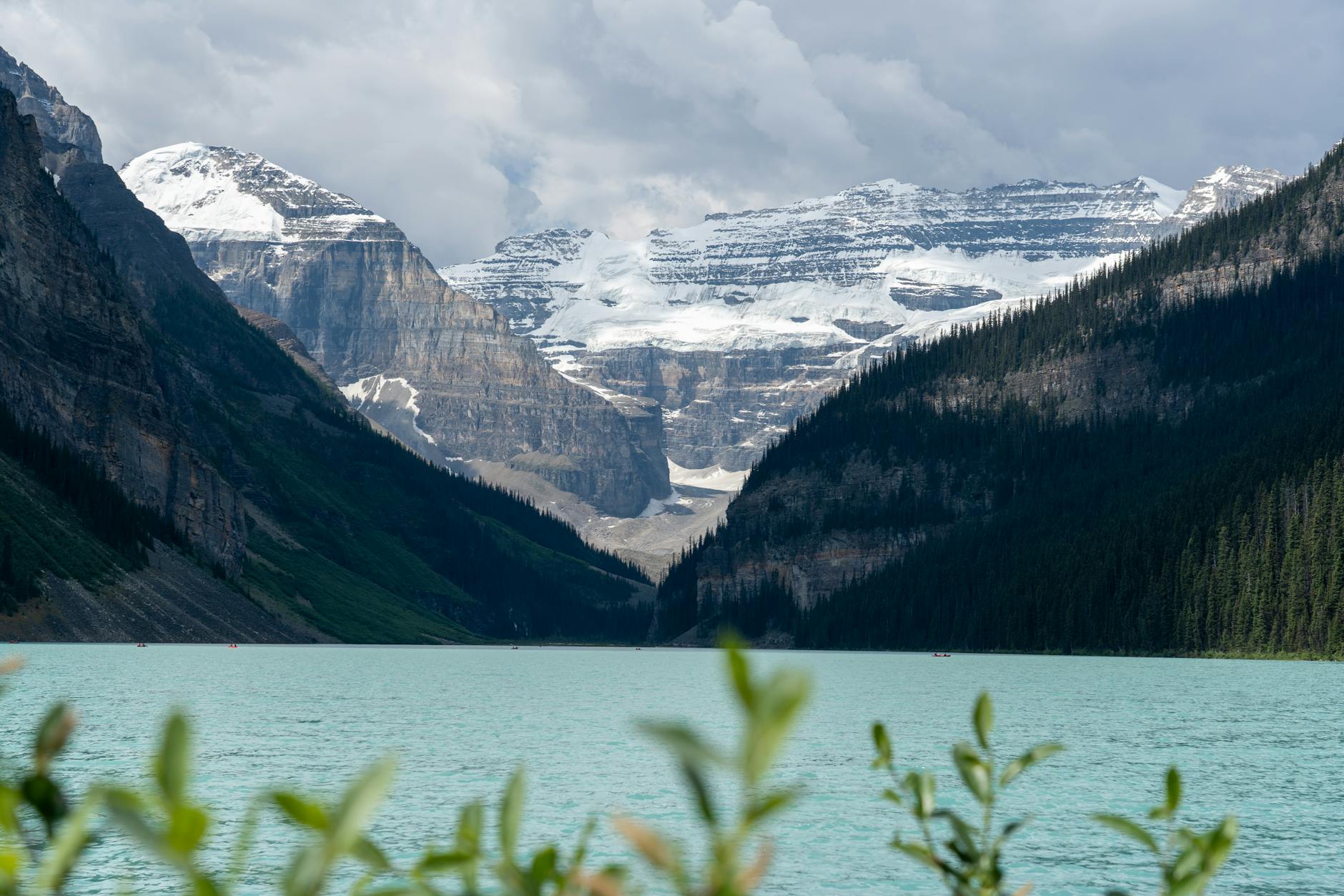 Lake Louise, Canada, turquoise glacial lake surrounded by snow-capped mountains