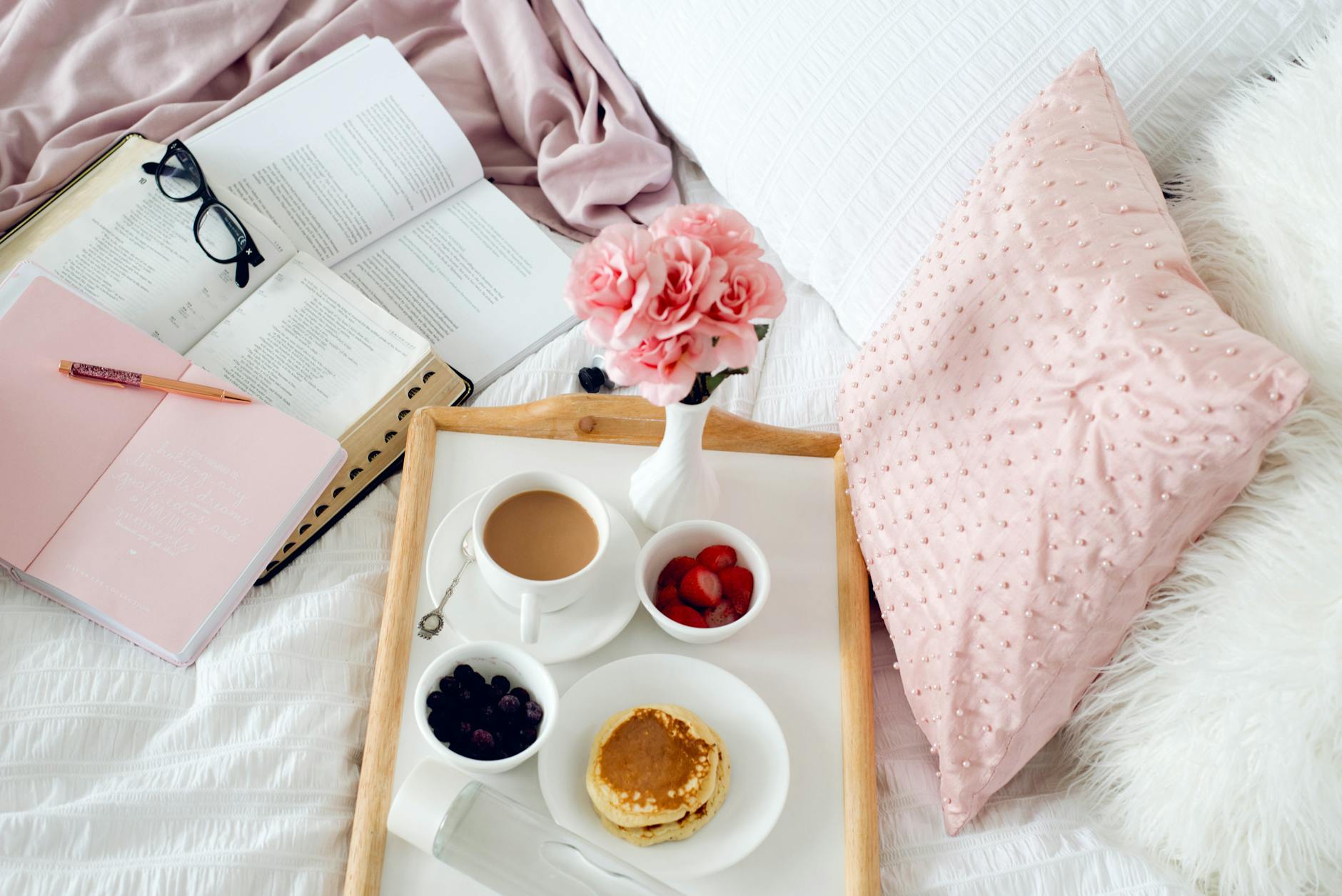 luxurious breakfast in bed with coffee and fruit