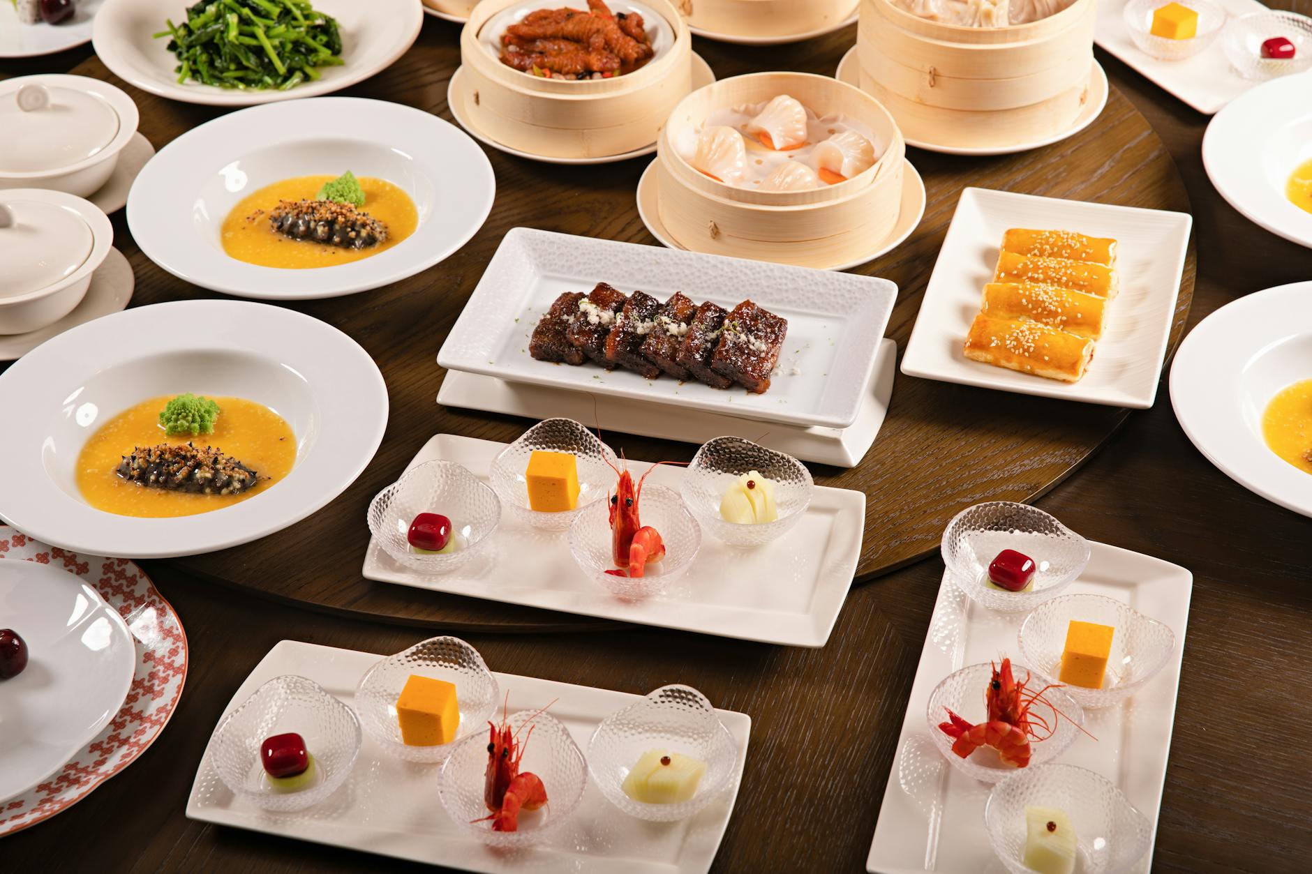 Colorful assortment of dim sum dishes on a table