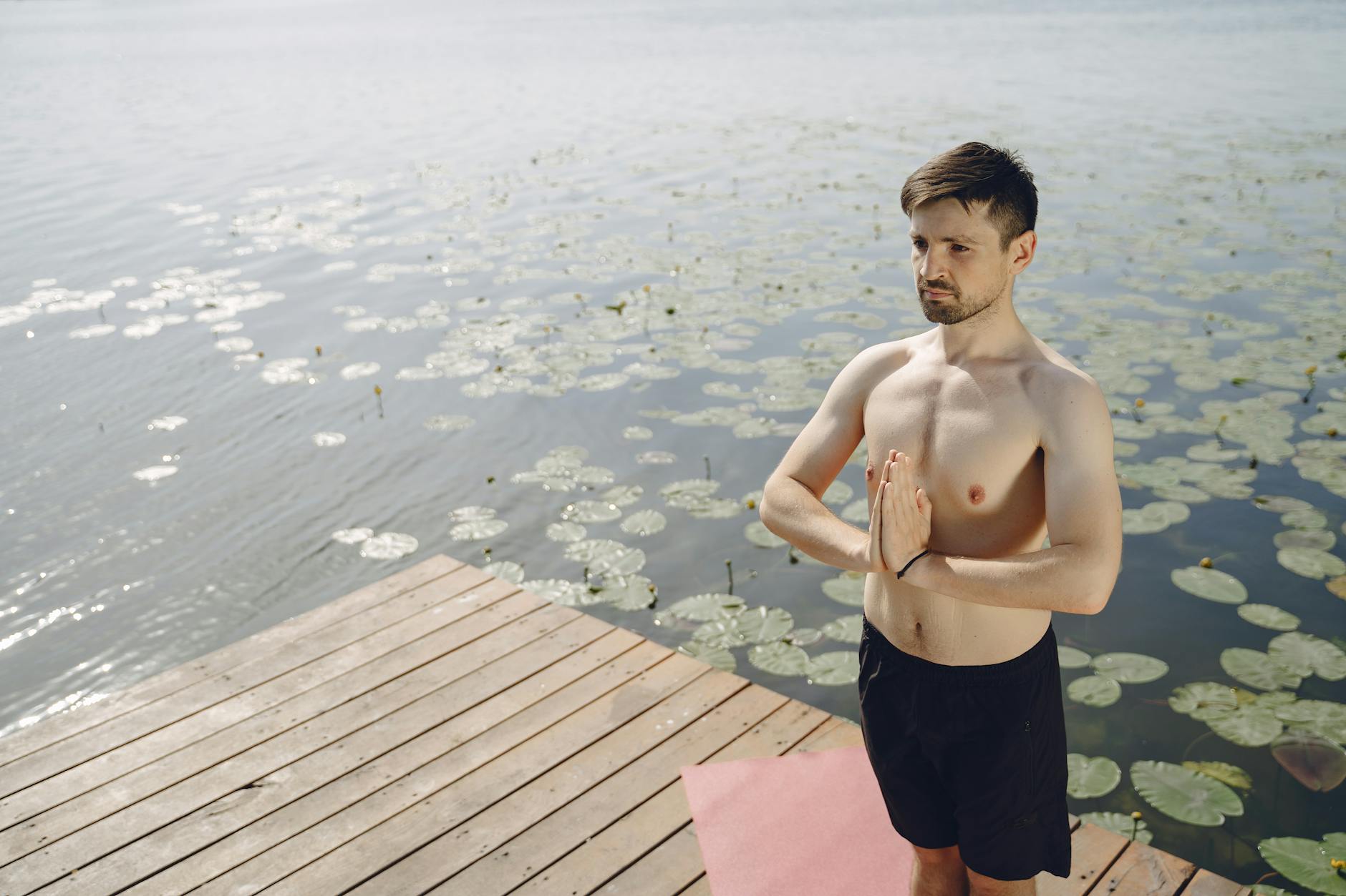 a person meditating in nature, symbolizing mindfulness and digital detox