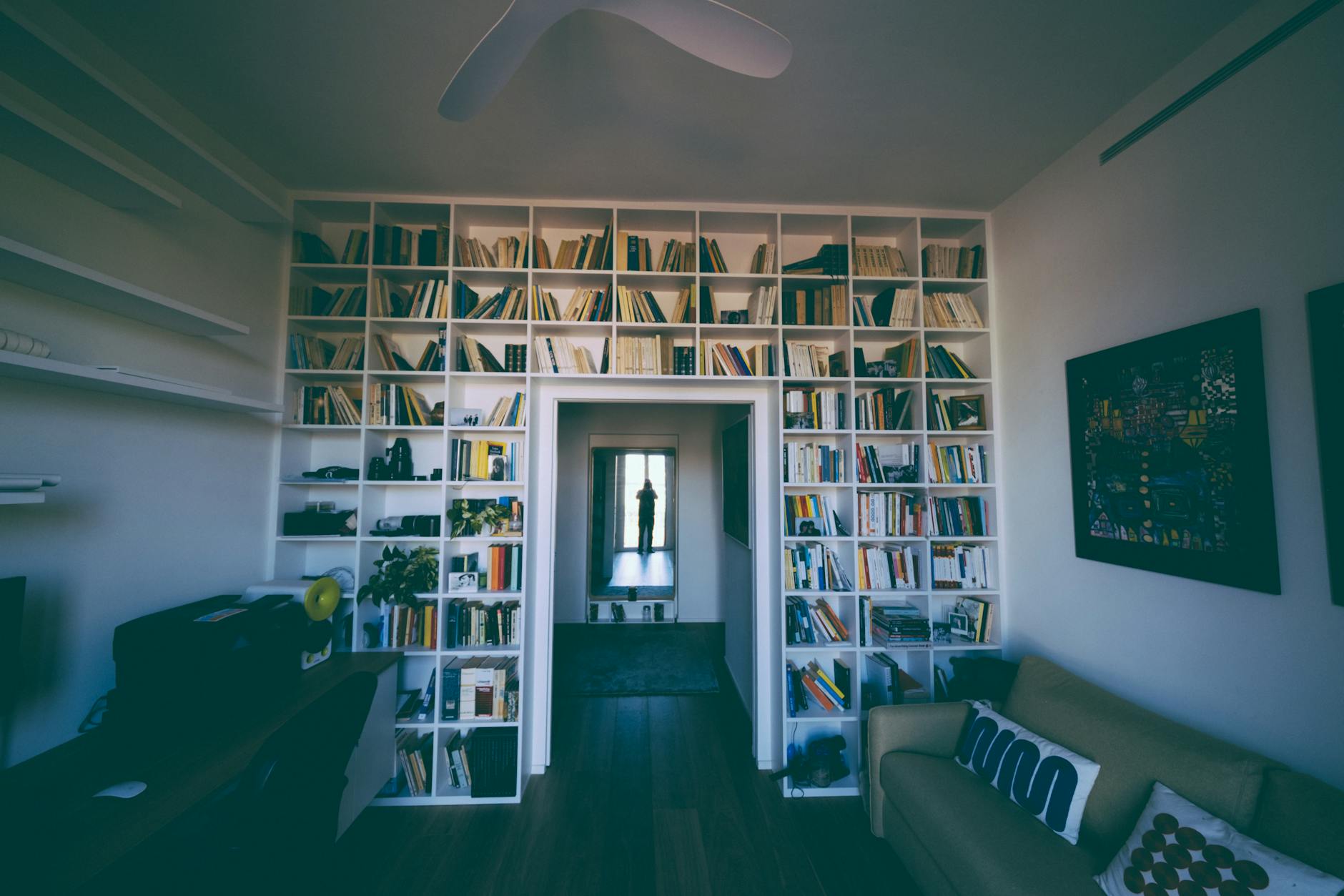 a person reading a book in a cozy environment, promoting alternative activities during digital detox