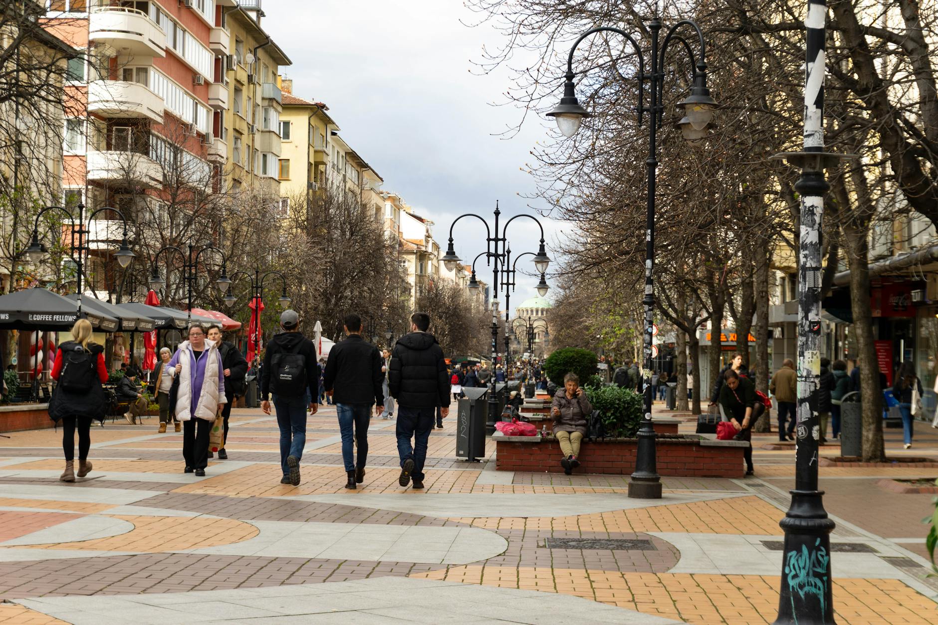 pedestrian-friendly city street with shops and cafes