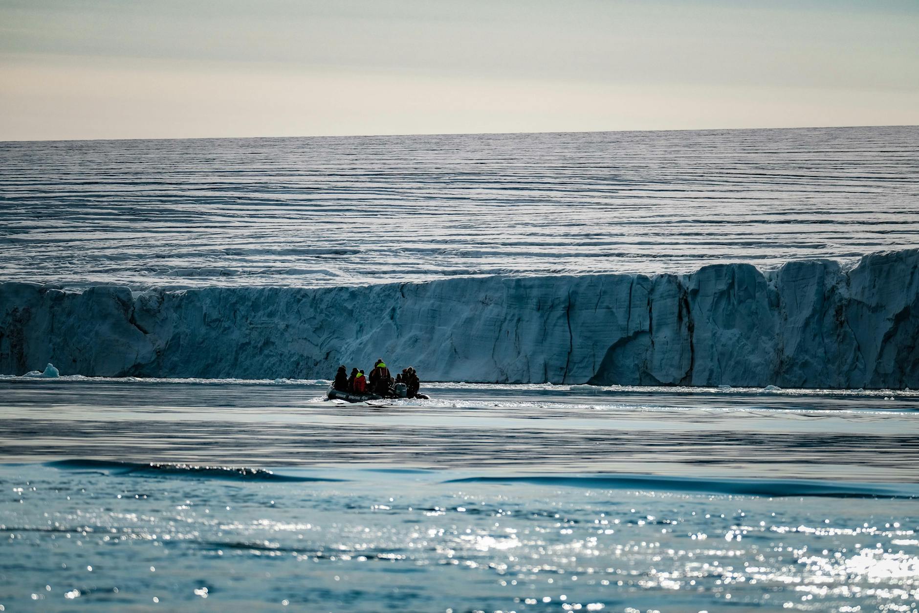 Exploration team navigating icebergs in the Arctic