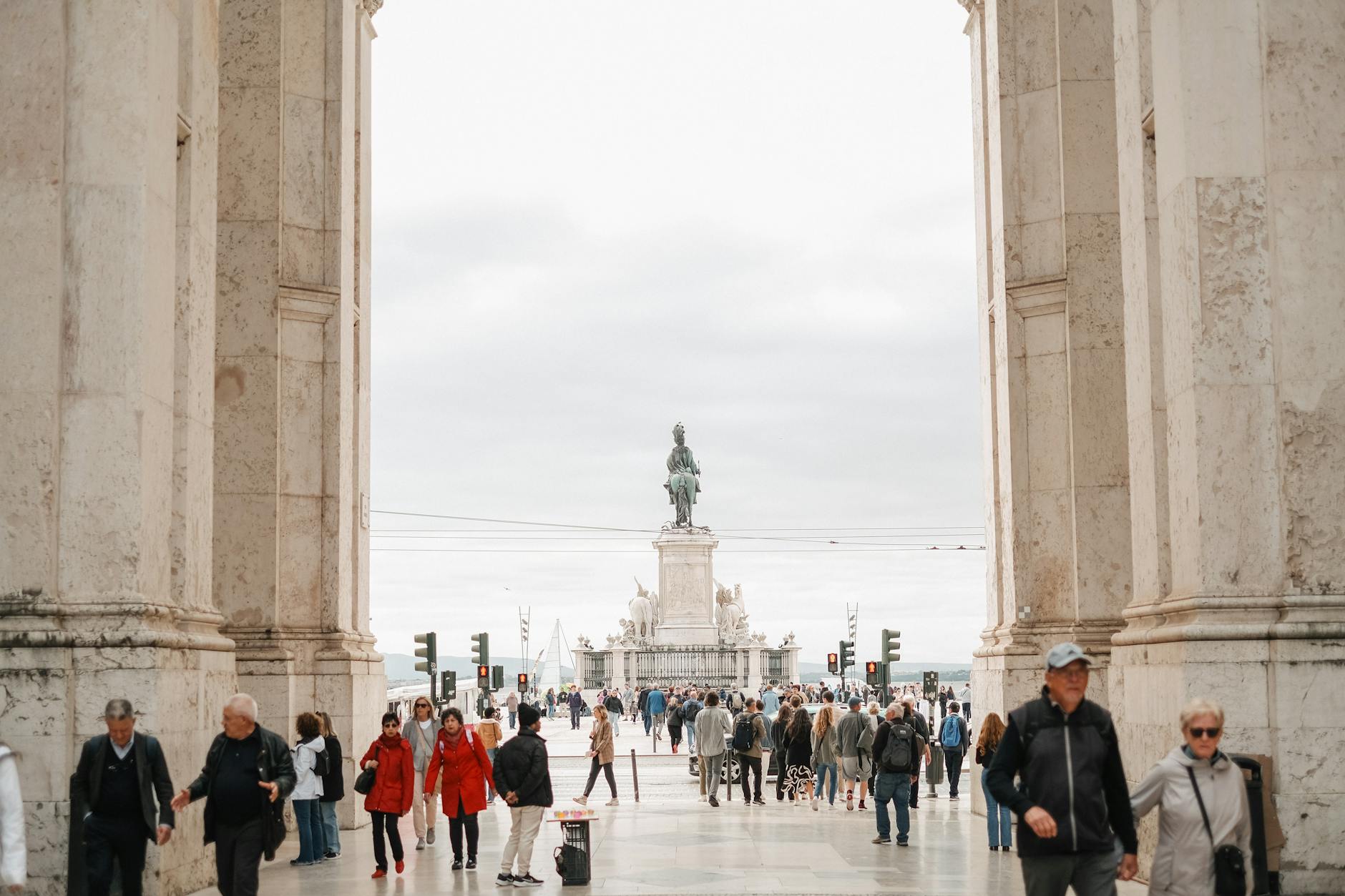 a bustling street in Lisbon showcasing cafes and historic architecture