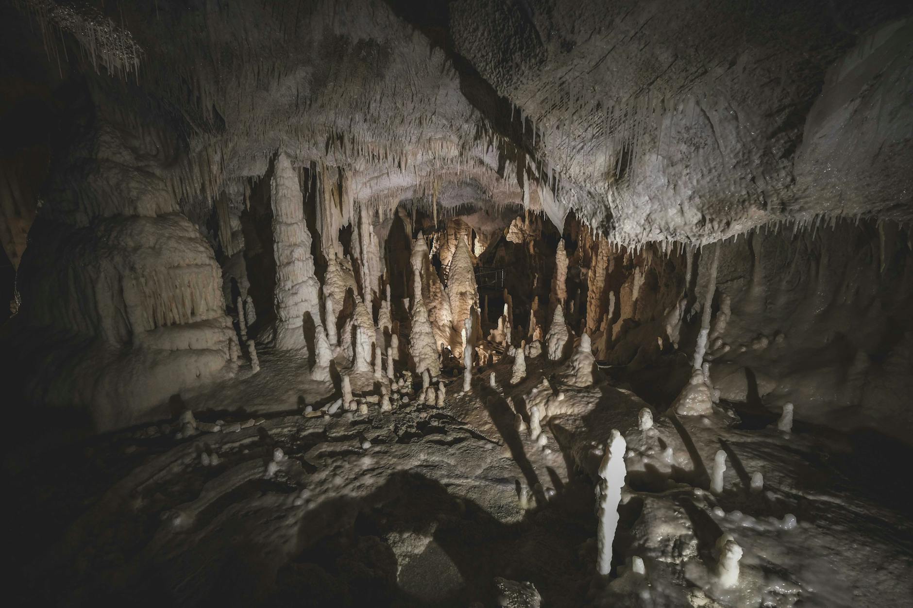 otherworldly caves with stalactites and stalagmites