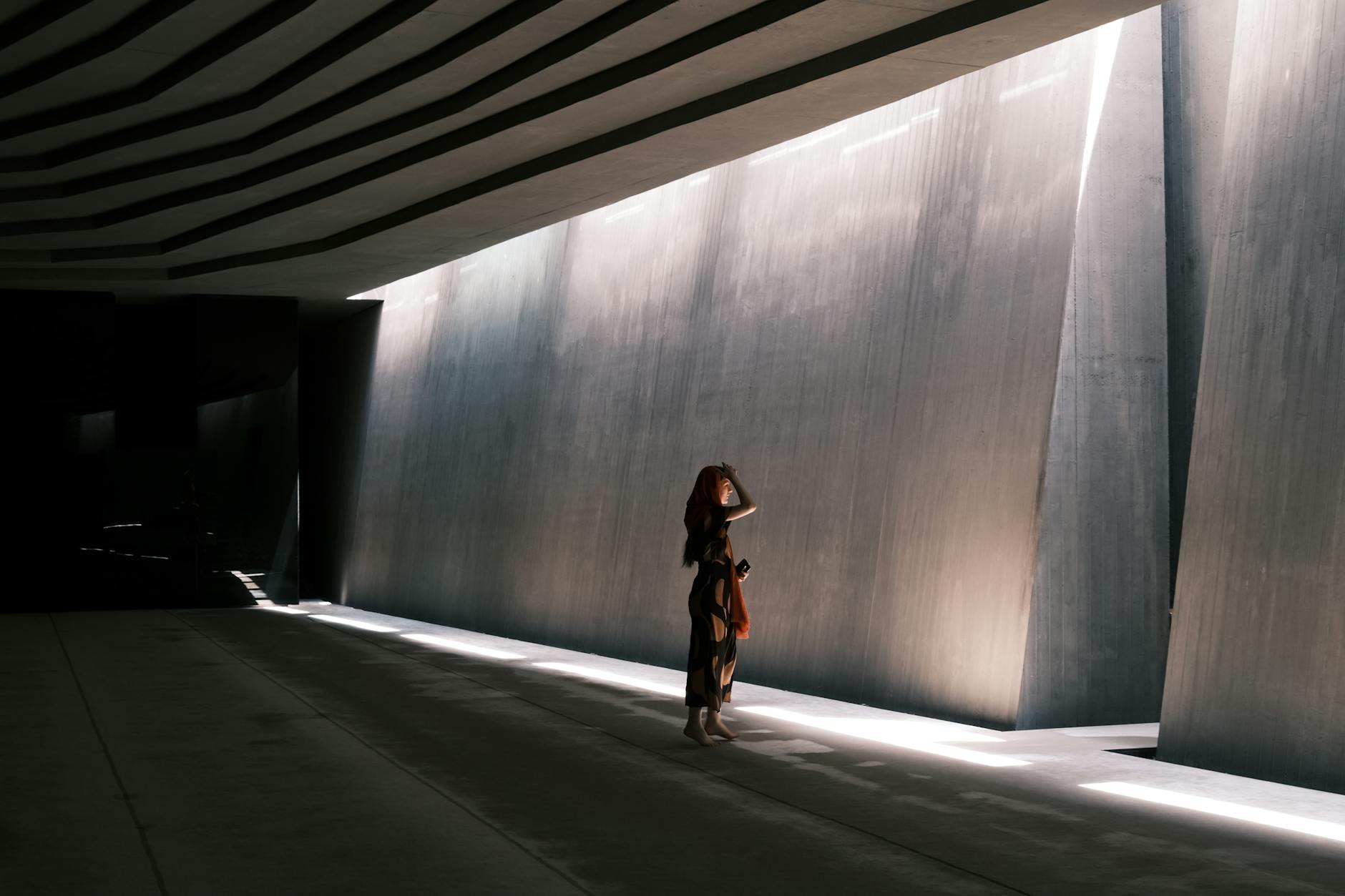 person meditating with technology around